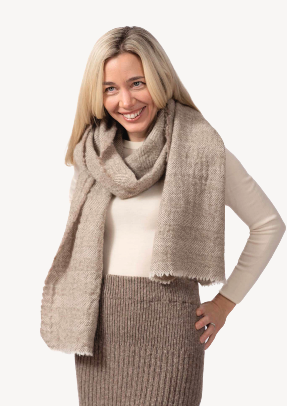 Beige herringbone scarf in responsible Finnish wool. Manufactured in Finland. 