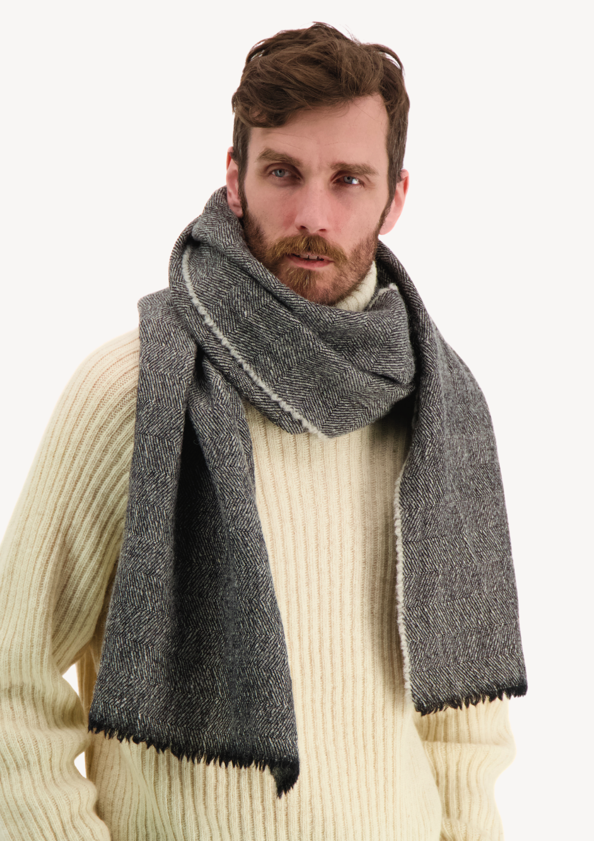 Black herringbone scarf made mostly out of responsible Finnish sheep wool. Manufactured in Finland. 