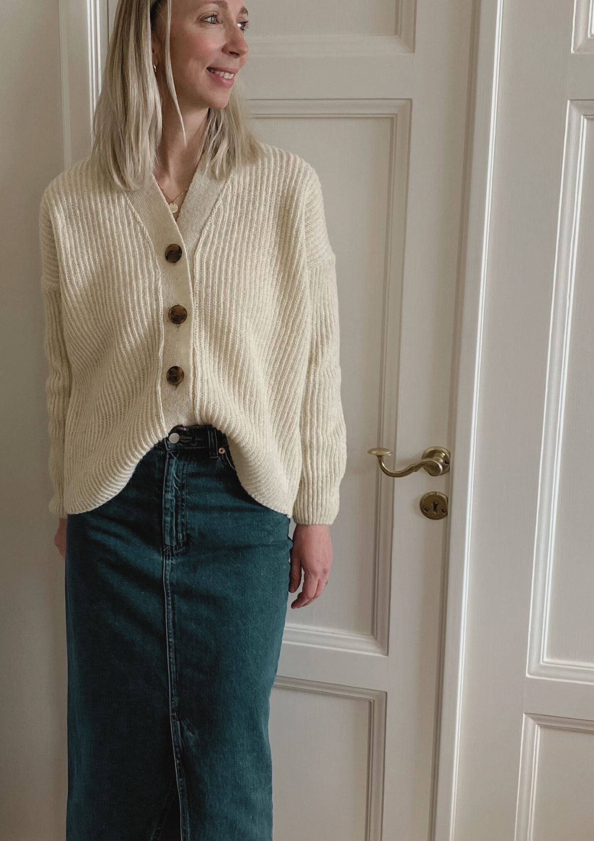 White ribbed cardigan made in Finland from Finnish sheep wool. Sustainable and ethical.  