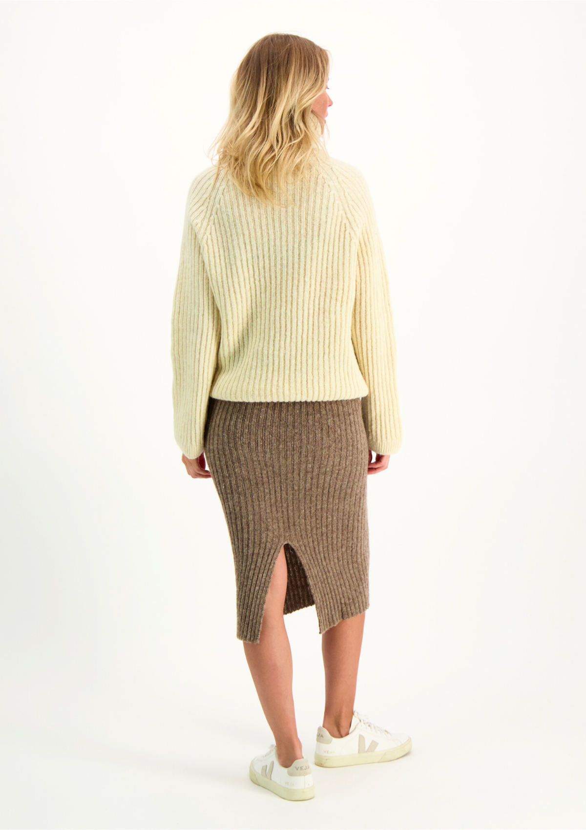 Beige ribbed midi skirt in Finnish responsible sheep wool. Made in Finland.  