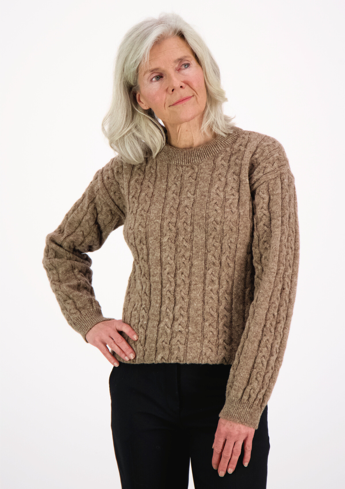 Soft and elegant cable knit in beige with o-neck. Made of responsible Finnish sheep wool in Finland. 