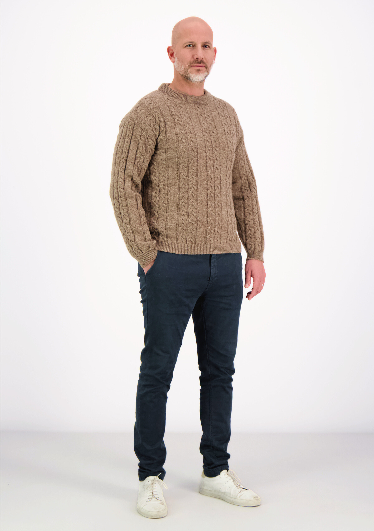 Soft and elegant cable knit in beige with o-neck. Made of responsible Finnish sheep wool in Finland. 