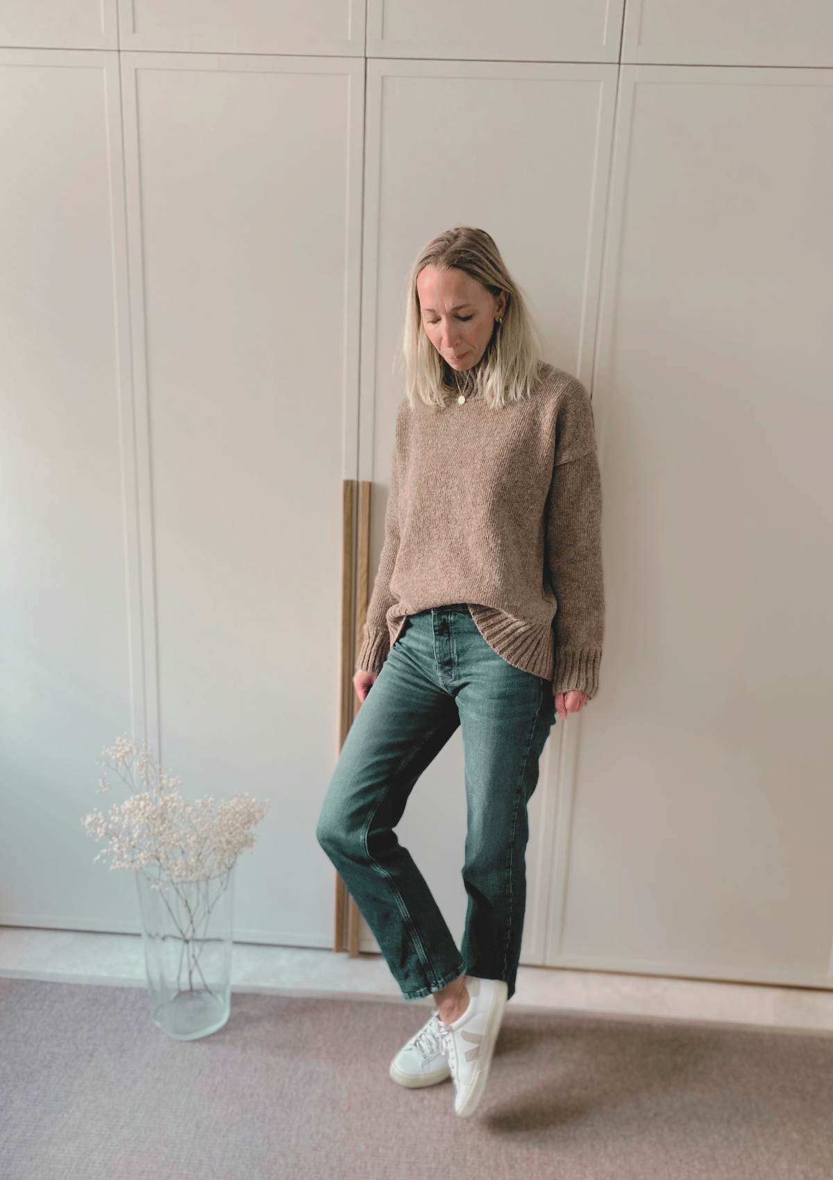 Beige responsible funnel-neck knit made out of Finnish sheep wool, manufactured in Finland.