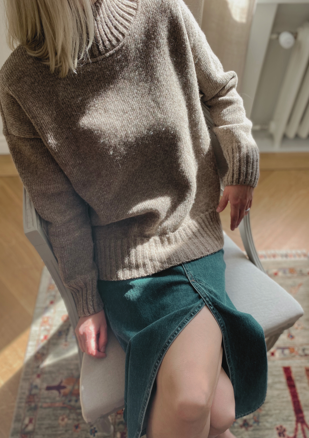 Beige responsible funnel-neck knit made out of Finnish sheep wool, manufactured in Finland.