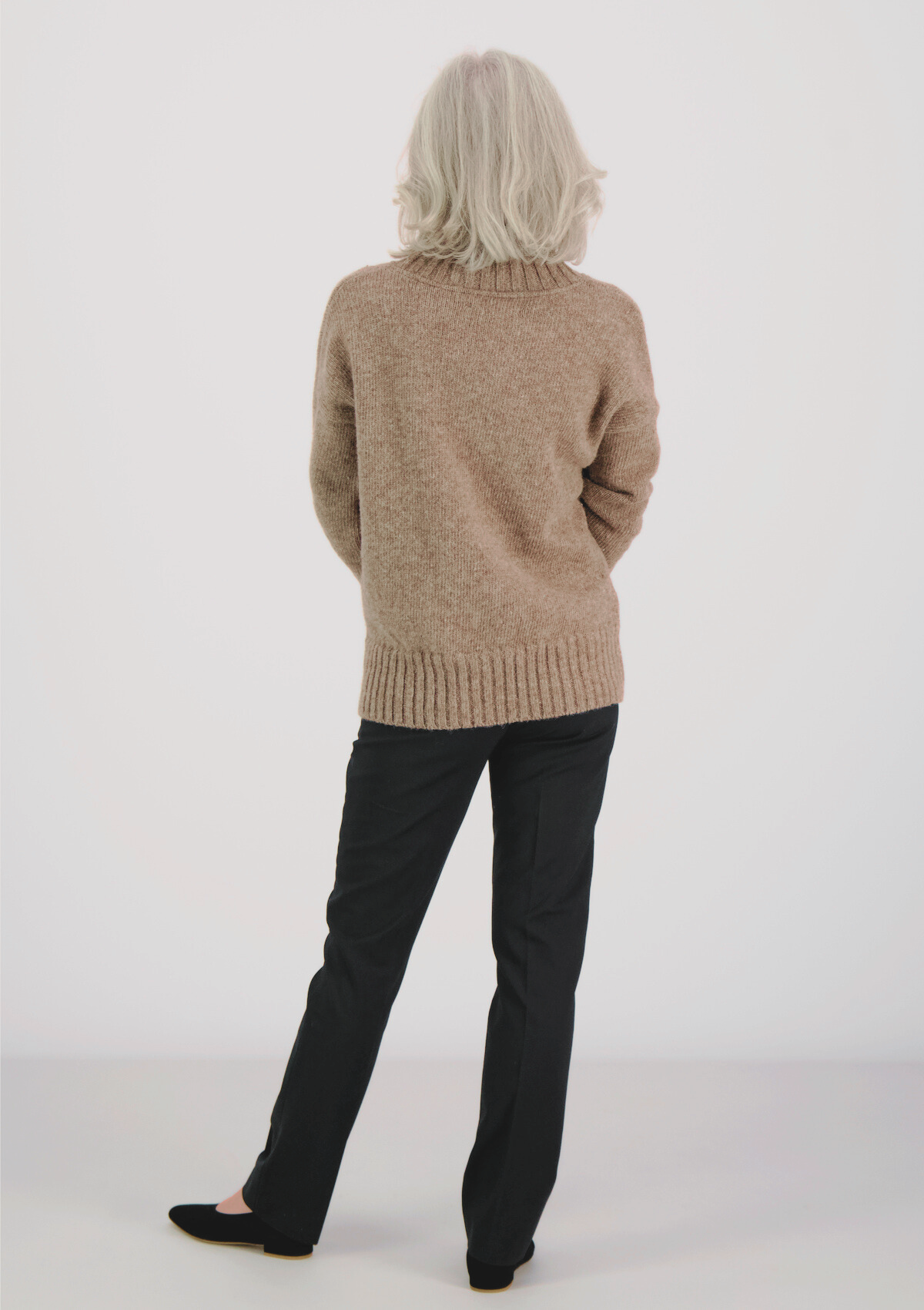 Beige responsible funnel-neck knit made out of Finnish sheep wool, manufactured in Finland.